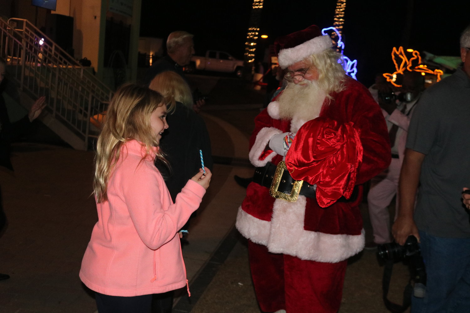 Santa Claus made an appearance and handed out candy canes to children in the crowd.